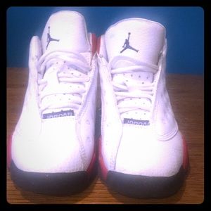 Red and white Jordan shoes
